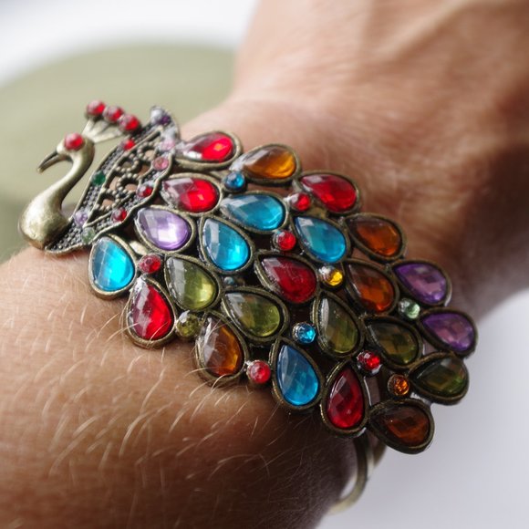 Jewelry - Peacock clamper bracelet. 2 1/4 inches inside diam